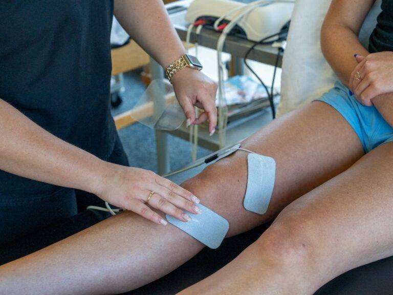Close-up of electrodes applied to knee during therapy